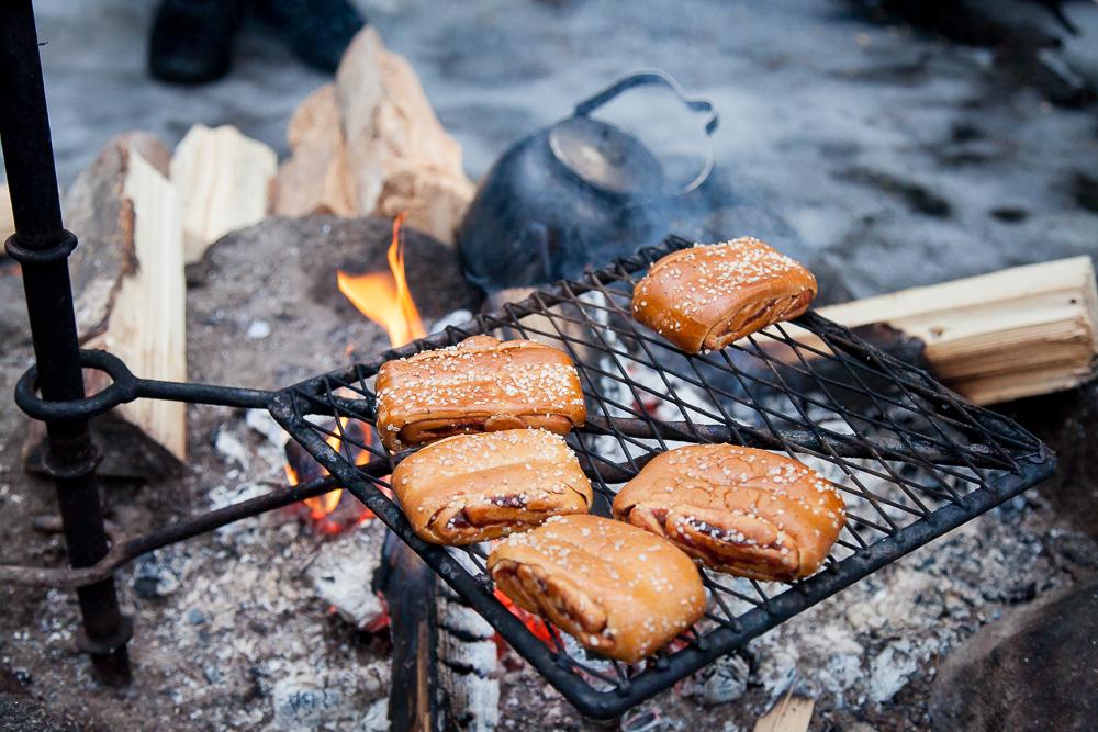 finnish korvapuusti heated over a fire nuuksio park espoo finland