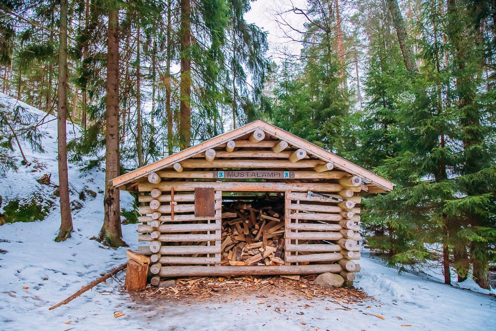winter firewood hut nuuksio national park finland