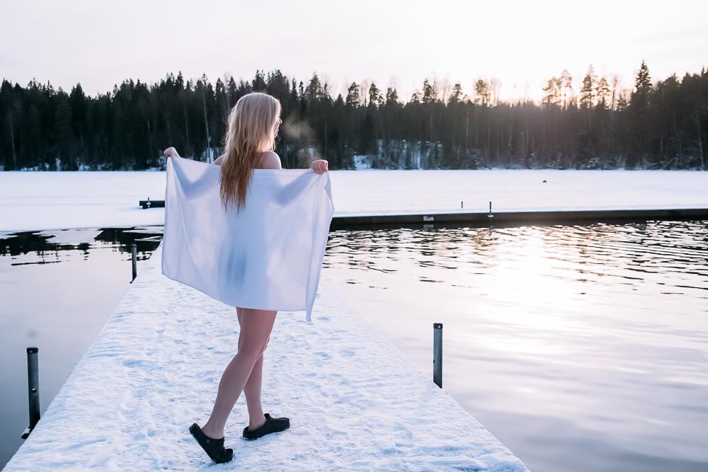 Kuusijärvi lake sauna experience Finland jumping in ice