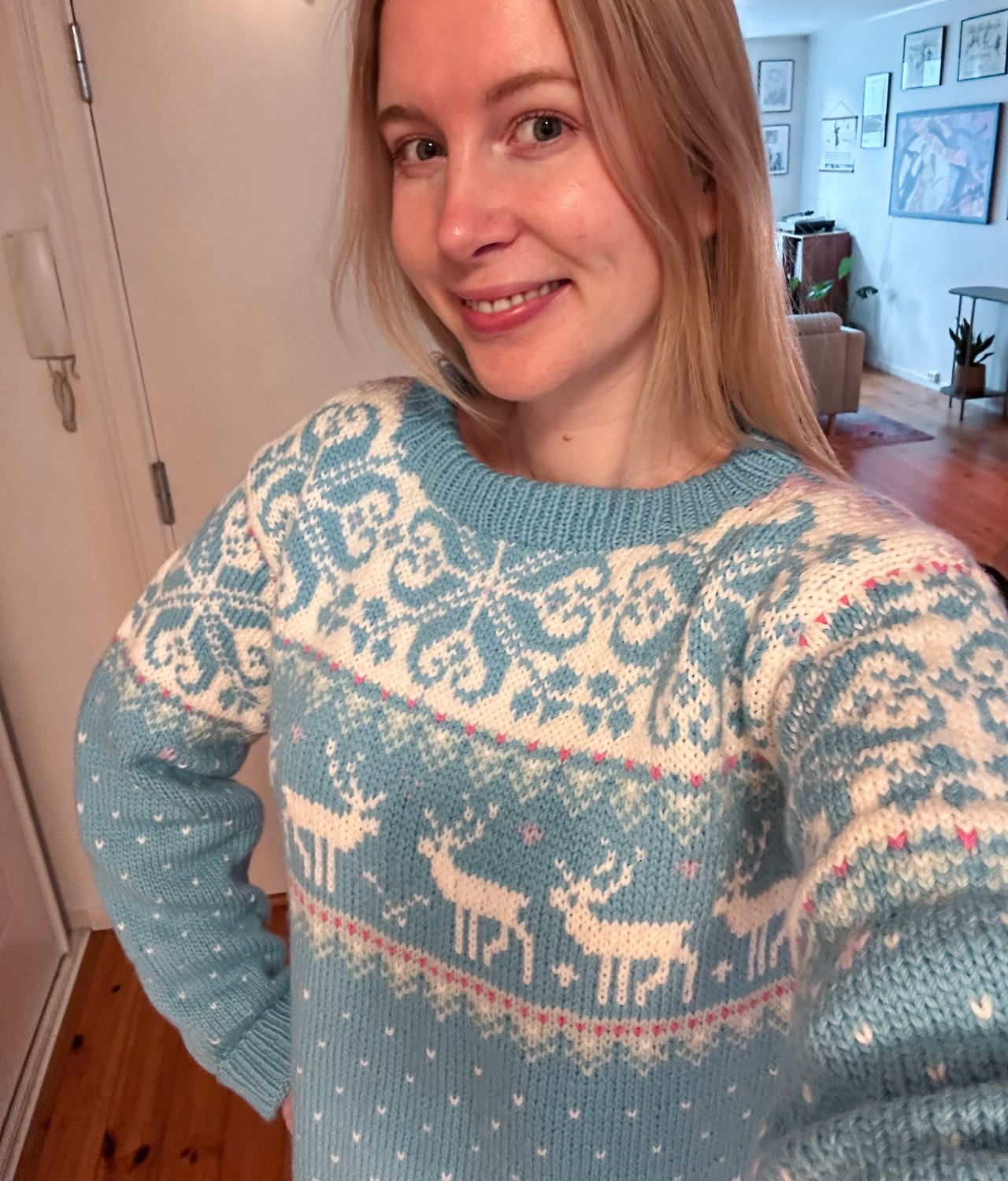 woman wearing light blue reindeer sweater