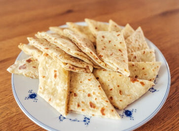 Norwegian lefse with kling (butter and sugar filling) arranged on a plate